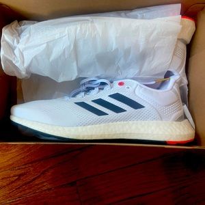 Men’s Adidas Pureboost, size 10.5, white, blue with red accents. New in box.